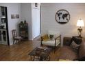 Well-decorated living room featuring stylish furniture, a world map wall decoration, and lots of light at 7026 Lenape Cir, New Port Richey, FL 34653