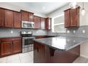 Close-up view of the kitchen featuring stainless steel appliances and granite counters at 12232 Trailhead Dr, Bradenton, FL 34211