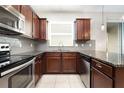 Kitchen featuring stainless steel appliances and granite counters at 12232 Trailhead Dr, Bradenton, FL 34211