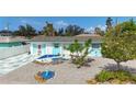 Charming home featuring a delightful front yard design with white and blue accents at 1790 Pomelo Dr, Venice, FL 34293
