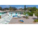 Charming home featuring a delightful front yard design with white and blue accents at 1790 Pomelo Dr, Venice, FL 34293