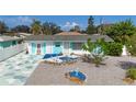 Charming home featuring a delightful front yard design with white and blue accents at 1790 Pomelo Dr, Venice, FL 34293