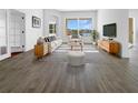 Bright living room features contemporary furnishings, stylish decor, and a large window with a view at 5154 51St W Ln, Bradenton, FL 34210
