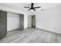 Clean bedroom design features new flooring, fresh paint, and a modern closet at 7490 Locust Ne St, St Petersburg, FL 33702