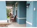 Inviting porch with a cozy seating area to enjoy outdoor living at 32618 Rapids Loop, Wesley Chapel, FL 33545