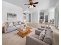 Bright living room with neutral tones and natural light, perfect for relaxing or entertaining guests at 6370 Sturbridge Ct, Sarasota, FL 34238