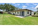 This property features a well-maintained backyard with lush green grass and a patio area at 6108 Penny Ln # 0, Bradenton, FL 34207