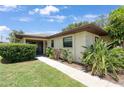 Beautiful home with a well-manicured lawn and walkway leading to the front door at 6108 Penny Ln # 0, Bradenton, FL 34207