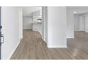 Entryway of a bright home with stylish floors and a view of the kitchen area at 623 Sandy Creek Dr, Brandon, FL 33511
