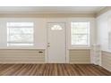 Bright entryway with hardwood floors, neutral walls, and plenty of natural light from two windows at 1424 14Th S St, St Petersburg, FL 33705