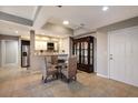 Open dining area with tile floors, an adjacent kitchen, and stylish furnishings at 1064 N Tamiami Trl # 1219, Sarasota, FL 34236