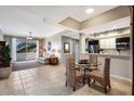 Inviting living space featuring tiled floors, combined kitchen, and a sliding door to the outside at 1064 N Tamiami Trl # 1219, Sarasota, FL 34236