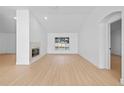 Spacious living room featuring a fireplace, wood flooring, and an open layout at 709 Tuscanny St, Brandon, FL 33511