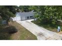 Charming home with a fenced yard, mature trees, and a long driveway at 8399 78Th N Ave, Seminole, FL 33777