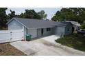An aerial view of a charming home with a fenced yard and a spacious driveway at 8399 78Th N Ave, Seminole, FL 33777