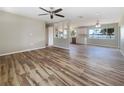 Spacious, open floor plan featuring new hardwood flooring and neutral paint, ready for personal touches at 18019 Avonsdale Cir, Port Charlotte, FL 33948