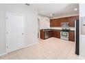 Well-equipped kitchen with stainless steel appliances and plenty of cabinet space at 14174 Oakham St, Tampa, FL 33626