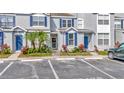 Attractive townhomes with blue shutters and vibrant landscaping enhancing curb appeal at 10429 Heron Lake Dr, Riverview, FL 33578