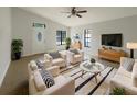 Bright living room featuring tiled floors, lots of seating, and lots of natural light at 11114 Shadybrook Dr, Tampa, FL 33625
