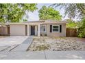 Charming single-story home featuring a freshly painted facade, a minimalist front yard, and a welcoming entrance at 4226 E Emma St, Tampa, FL 33610