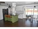 Open kitchen with a large island, modern appliances, and a sliding glass door to the patio at 821 Silver Springs Nw Ter, Port Charlotte, FL 33948