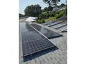 Roof-mounted solar panels offer energy efficiency for this home, reducing utility costs and promoting sustainable living at 2580 68Th S Ave, St Petersburg, FL 33712