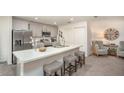 Contemporary kitchen with an island, stainless steel appliances, and lots of cabinets, great for cooking and entertaining at 16408 Courlan Rd, Weeki Wachee, FL 34614