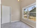 Dining area featuring tile floors, neutral walls, and a bright window offering plenty of natural light at 205 Island Water Way, Apollo Beach, FL 33572
