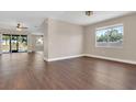 Spacious living area featuring hardwood floors, and an open layout perfect for entertaining at 6412 Coquina Island Cv, Apollo Beach, FL 33572
