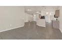 Expansive living area with tile flooring throughout and neutral walls, providing versatile layout options at 806 Rocky Mountain Ct, Valrico, FL 33594