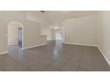 Open-concept living space features tile flooring, neutral walls, and ample natural light, perfect for entertaining at 806 Rocky Mountain Ct, Valrico, FL 33594