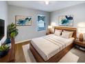 Cozy bedroom with a plush rug, neutral tones, and natural light at 5383 Magdalene Way, Zephyrhills, FL 33541