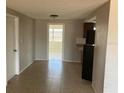 Dining area with tile flooring, access to the kitchen and sunroom, and lots of natural light at 3347 Roxbury Dr, Holiday, FL 34691