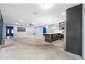 Spacious living room and modern kitchen with stainless steel appliances, perfect for customization at 2302 16 W St, Palmetto, FL 34221