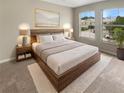 Modern bedroom with a large bed, soft carpet, and bright windows at 915 Woodbridge Ct, Safety Harbor, FL 34695