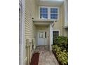 Charming home exterior with well-maintained landscaping and a welcoming entrance at 915 Woodbridge Ct, Safety Harbor, FL 34695