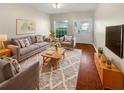 Cozy living room featuring a plush rug, comfortable seating, and a bright, welcoming atmosphere at 915 Woodbridge Ct, Safety Harbor, FL 34695