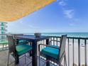 Balcony with black dining set with seating and view of the ocean and beach at 14146 Gulf Blvd # 3A, Madeira Beach, FL 33708