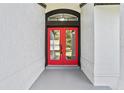 Stylish front entry with a vibrant red double door at 1438 Mclin Dr, Plant City, FL 33565
