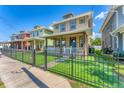Inviting two-story home with a quaint front porch and fenced-in yard at 3027 W Spruce St, Tampa, FL 33607
