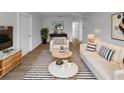 Bright living room boasts stylish furnishings, modern decor, and hardwood flooring at 3410 Grove Street Cir, Tampa, FL 33610