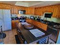 Functional kitchen with dark countertops, ample cabinetry, stainless appliances, and a central island at 4419 Waltham Dr, Tampa, FL 33634