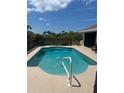 Relaxing backyard pool perfect for cooling off on hot days, complete with a playful swan float at 8252 Tecumseh Cir, Port Charlotte, FL 33981