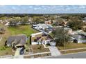 Spacious suburban home with fenced backyard, neighboring houses, and green spaces, perfect for families and outdoor living at 4604 Hunts Ave, Plant City, FL 33566