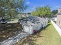 Aerial view showcases the home's roof, driveway, and surrounding fenced yard at 4601 Copper Ln, Plant City, FL 33566