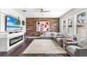 Cozy living room with a fireplace, modern decor, and ample natural light at 14095 Tropical Kingbird Way, Riverview, FL 33579