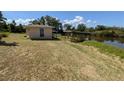 A waterfront property features a small building with a dock area and access to the canal at 155 Summerset Dr, Punta Gorda, FL 33982