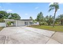 Inviting single-story home with a spacious driveway and well-maintained landscaping at 5629 36Th N Ave, St Petersburg, FL 33710