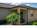A covered front porch with outdoor seating, a lovely entryway, and curb appeal, creating a warm and inviting welcome at 8410 Red Spruce Ave, Riverview, FL 33578