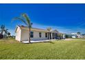 Charming single-story home with a well-manicured lawn and attractive landscaping at 1933 Oregon Trl, Englewood, FL 34224